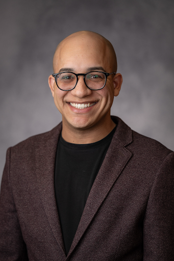 Nolgie Oquendo-Colón smiles in a professional headshot